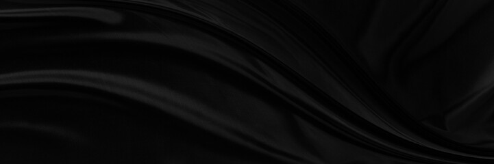 Black gray satin dark fabric texture luxurious shiny that is abstract silk cloth panorama background with patterns soft waves blur beautiful.