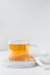 Tea in a glass cup, freshly brewed black tea in a trendy glass cup