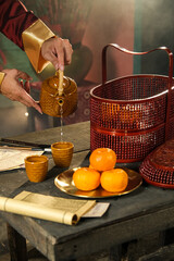 hand in frame pouring tea