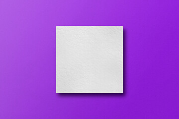paper cut into square shapes with light and shadow Placed on a purple paper background.