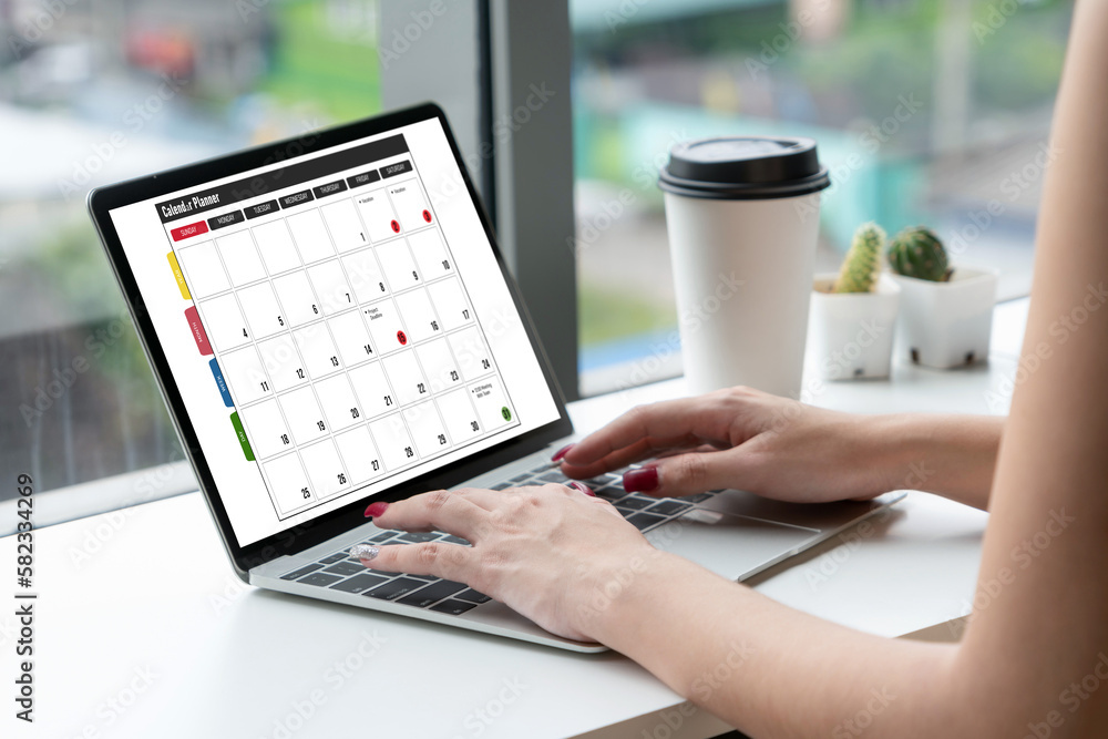 Poster calendar on computer software application for modish schedule planning for personal organizer and on