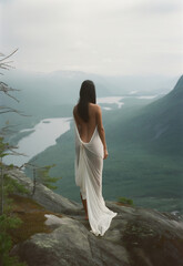 Fototapeta na wymiar woman in white dress looking over amazing view