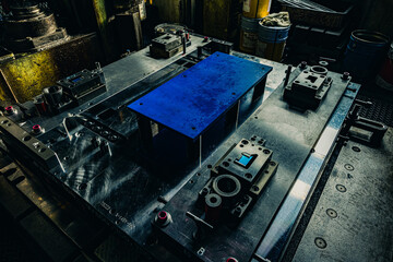 Sheet Metal Stamping Tool Die for Automotive Precision Parts on The Numerical Control Milling Machine Table. Tandem Stamping System. At a High Quality Technology Factory. Black and White Photography.