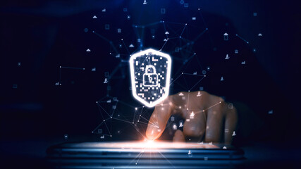 Cyber security concept and digital technology. A person is touching a smartphone with their hands to access an application with a shield to prevent threats in connecting to the Internet.