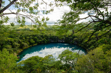 A large and beautiful cenote in a tropical country