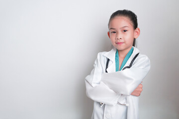 Asian child Wearing a doctor's suit and having a stethoscope