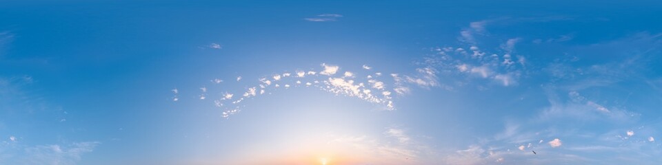 Bright sunset sky panorama with Cirrus clouds. Seamless hdr spherical equirectangular 360 panorama. Sky dome or zenith for 3D visualization, game and sky replacement for aerial drone 360 panoramas.
