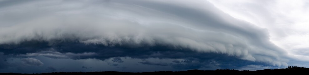 Panoramic Photo of Cumulus Arcus Clouds Over a Silhouetted City.