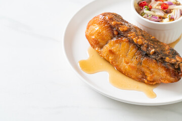 fried snapper fish with fish sauce and spicy salad