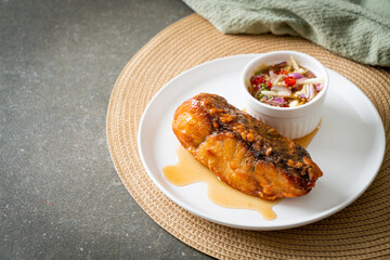 fried snapper fish with fish sauce and spicy salad