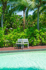 empty chair around swimming pool