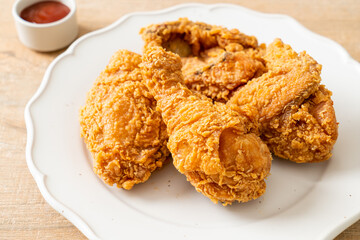 fried chicken with ketchup on plate