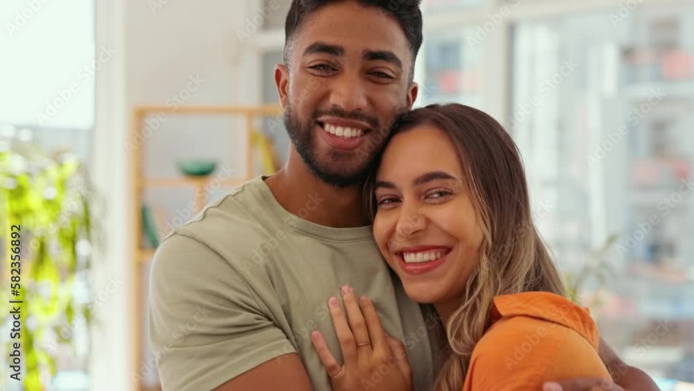 Sticker Face, hug and couple moving into new house together, happy and excited for beginning of young marriage. Portrait, love and man with woman embracing in living room, happiness and smile in their home