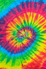 spiral tie dye pattern hand dyed on cotton fabric abstract texture background.