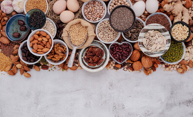 Ingredients for the healthy foods selection. The concept of superfoods set up on white shabby concrete background with copy space. - 582361631