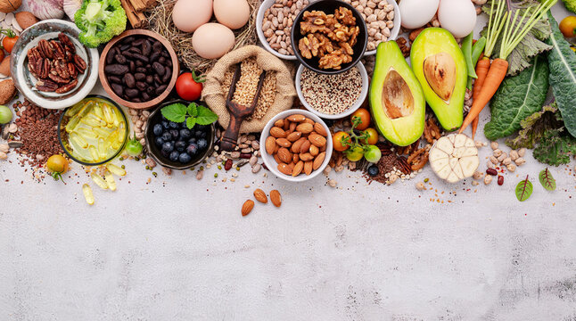 Ingredients for the healthy foods selection. The concept of superfoods set up on white shabby concrete background with copy space.