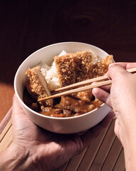 Bowl of Japanese curry and chopsticks