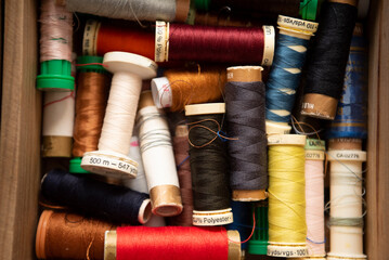 Spools of sewing threads of different colors