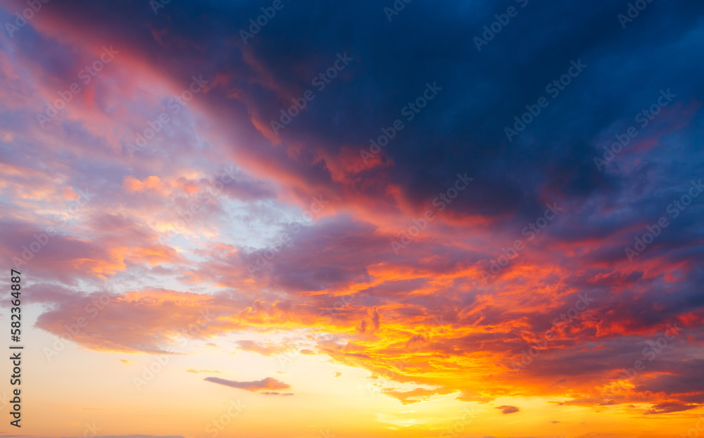 Poster Utterly spectacular sunset with colorful clouds lit by the sun. Bright epic sky.