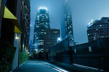 Downtown city buildings foggy night