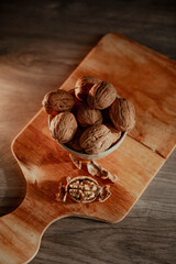 Greek nuts in shell on a wooden board