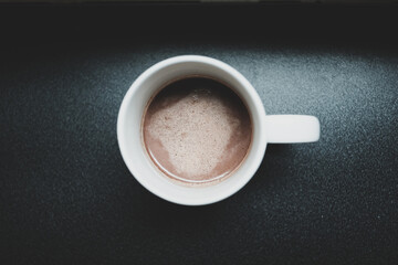Hot chocolate drink in a white ceramic cup.