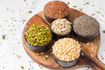 healthy seeds flax seeds,watermelon seeds,pumpkin seeds,chia seeds. selective focus.