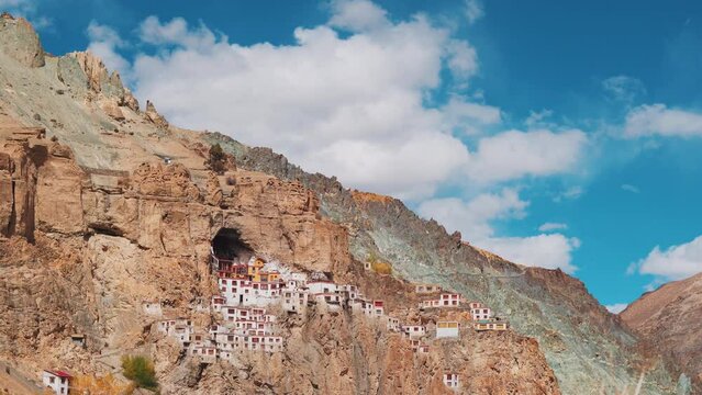 4K shot of Phugtal Monastery made in a natural cave near Purne village in Zanskar, Ladakh India. Ancient monastery made in a cave more than 2550 years ago in India. Monastery built inside the cave. 