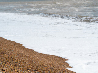 blue sea with waves and sandy shore ,beautiful natural seascape