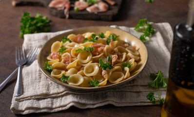 Homemade pasta with ham and garlic