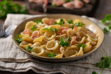 Homemade pasta with ham and garlic