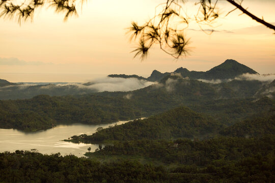 Scenic view of mountains and lake against sky during sunset