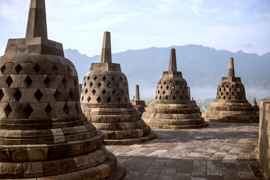Stupas at Prambanan temple against mountains=-=