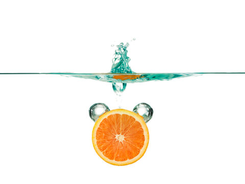 Orange slice in water against white background