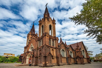 Fototapeta na wymiar Beautiful red brick Catholic church