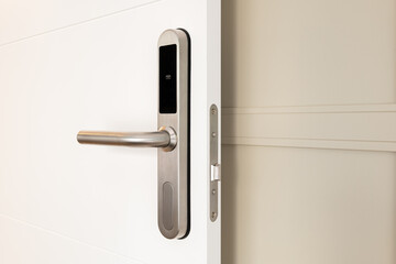Open front door with electronic mortise lock and handle. The door is opened with a combination of a...