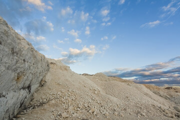 hills from a lime quarry and soft clouds at the sky