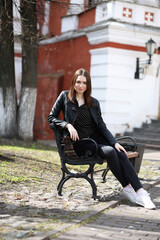 Girl on a walk through the spring city