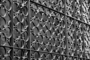 Photo of a metal welded grating with an ornament.