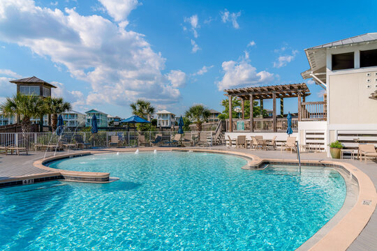 DESTIN, FLORIDA - CIRCA MAY, 2022: Destin Pointe by Vacasa scenic private pool. SUnny day view of a recreational pool with clear water warmed by sunlight on this sunny day.