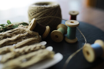 Old scissors, spools of colored thread, centimeter and tailors chalk, flat lay, concept of sewing...