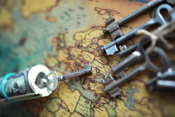 International world management concept.Background with compass, vintage key, vintage tone on ancient world map.