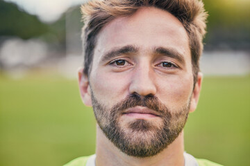 Fototapeta premium Rugby, field and portrait of man with serious expression, confidence and pride in winning game. Fitness, sports and zoom on face of player ready for match, workout or competition on grass at stadium.