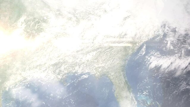 Earth zoom in from outer space to city. Zooming on Opelika, Alabama, USA. The animation continues by zoom out through clouds and atmosphere into space. Images from NASA