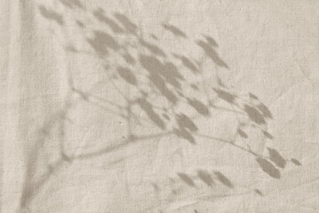 Aesthetic minimalist neutral background with sunlight shadows on beige textile, copy space