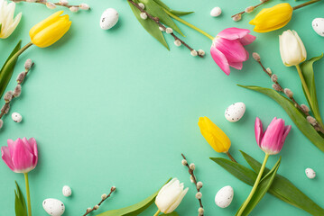 Easter atmosphere concept. Top view photo of quail eggs pussy-willow and colorful tulips on isolated turquoise background with empty space in the middle - obrazy, fototapety, plakaty