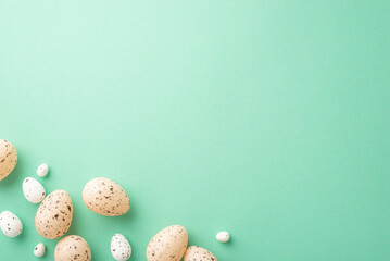 Easter mood concept. Top view photo of quail easter eggs on isolated turquoise background with empty space