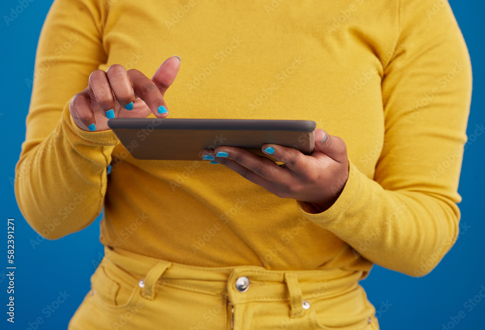 Poster hands, tablet and search with a woman on a blue background in studio for research on the internet. s