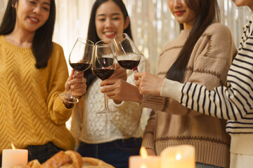 Birthday party concept, Asian girls standing to clinking glass of wine in celebrate birthday party