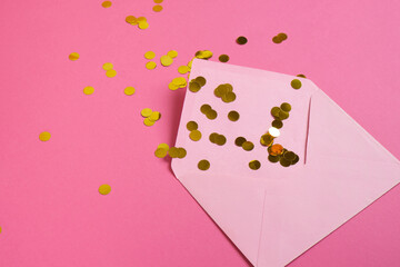 Pink paper envelope mockup on pink background. Flat lay, top view. Romantic love letter for Valentine's day concept.